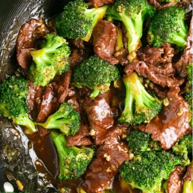 Authentic Beef and Broccoli dish with tender beef slices and green broccoli florets.