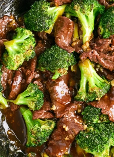 Authentic Beef and Broccoli dish with tender beef slices and green broccoli florets.