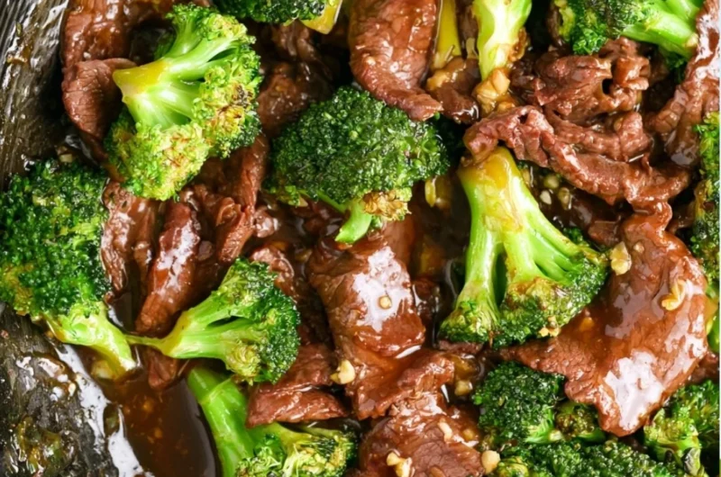 Authentic Beef and Broccoli dish with tender beef slices and green broccoli florets.