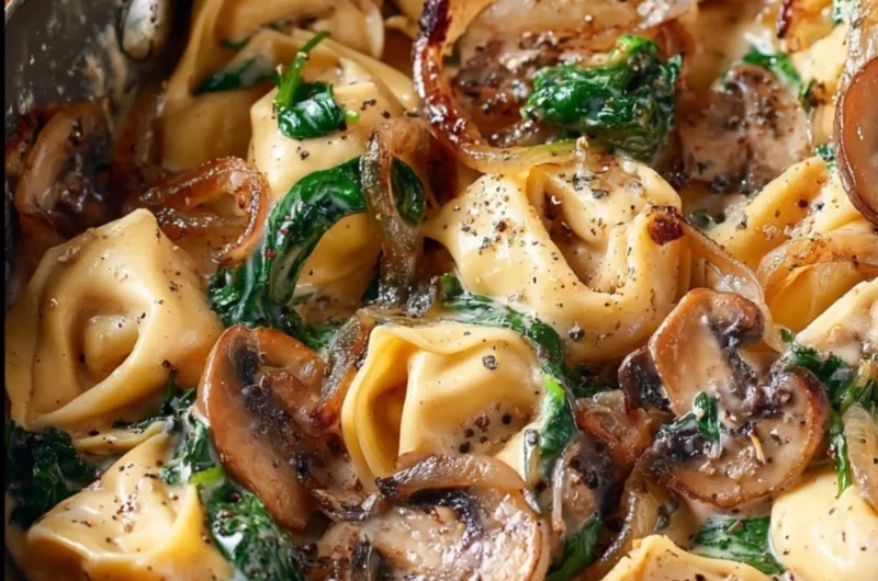 Cozy creamy tortellini with spinach, mushrooms, and caramelized onions dish