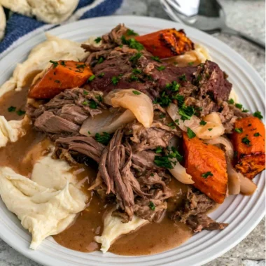 Crock Pot 3-Packet Pot Roast cooking in a slow cooker with spices and vegetables