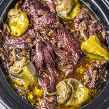 Delicious Crockpot Mississippi Pot Roast served with vegetables on a plate