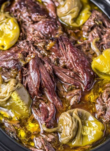 Delicious Crockpot Mississippi Pot Roast served with vegetables on a plate