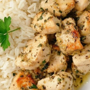 Plate of easy garlic chicken bites garnished with herbs