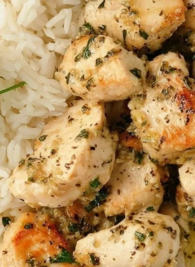 Plate of easy garlic chicken bites garnished with herbs