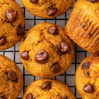 Freshly baked easy mini pumpkin muffins on a cooling rack