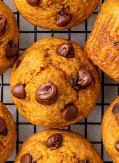 Freshly baked easy mini pumpkin muffins on a cooling rack