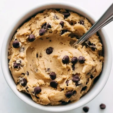 Bowl of delicious edible cookie dough with chocolate chips
