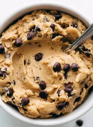 Bowl of delicious edible cookie dough with chocolate chips