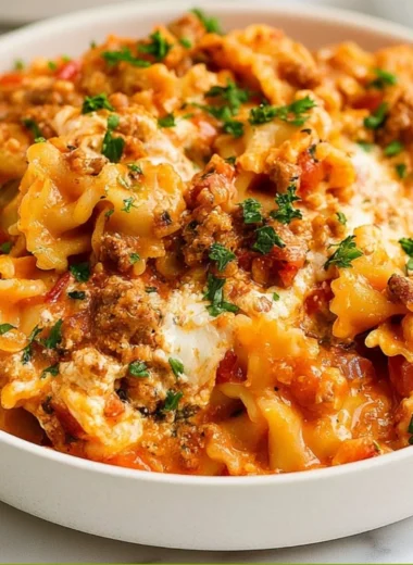 Instant Pot lazy lasagna served in a bowl with fresh basil.