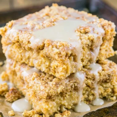 Protein-packed sugar-free cinnamon roll baked oatmeal dish topped with cinnamon.