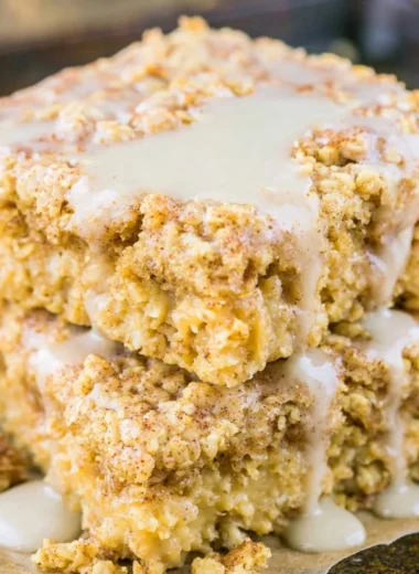 Protein-packed sugar-free cinnamon roll baked oatmeal dish topped with cinnamon.