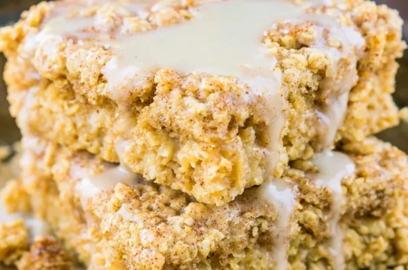 Protein-packed sugar-free cinnamon roll baked oatmeal dish topped with cinnamon.