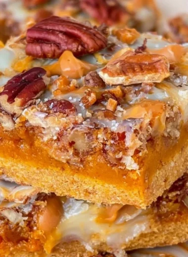 Delicious Pumpkin Magic Bars with a creamy topping and pumpkin filling