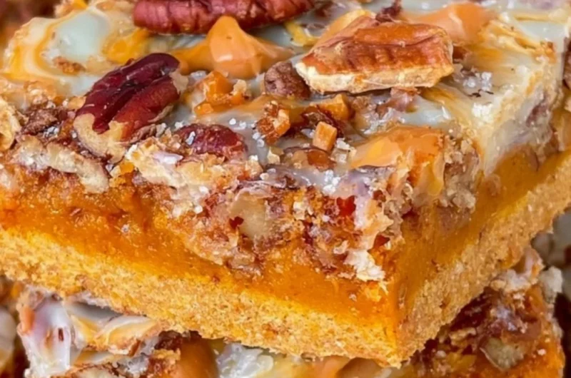 Delicious Pumpkin Magic Bars with a creamy topping and pumpkin filling
