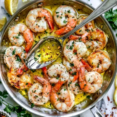 Delicious plate of Shrimp Scampi with garlic butter sauce and fresh herbs
