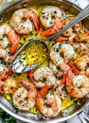 Delicious plate of Shrimp Scampi with garlic butter sauce and fresh herbs