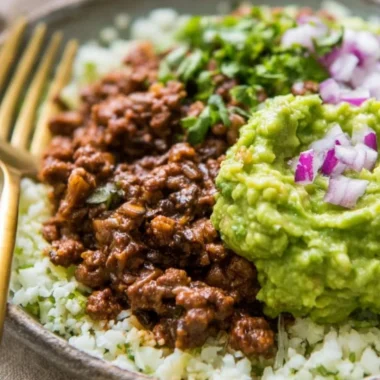 Whole30 Chipotle Beef and Avocado Bowls on a plate ready to be enjoyed