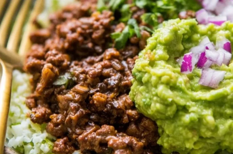 Whole30 Chipotle Beef and Avocado Bowls on a plate ready to be enjoyed