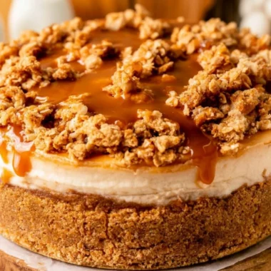 Delicious apple crumble cheesecake with a crunchy topping and creamy filling.