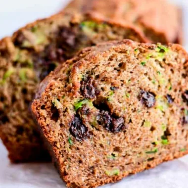 Loaf of chocolate chip zucchini bread on a wooden table