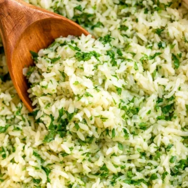 Bowl of flavorful cilantro lime rice garnished with fresh cilantro