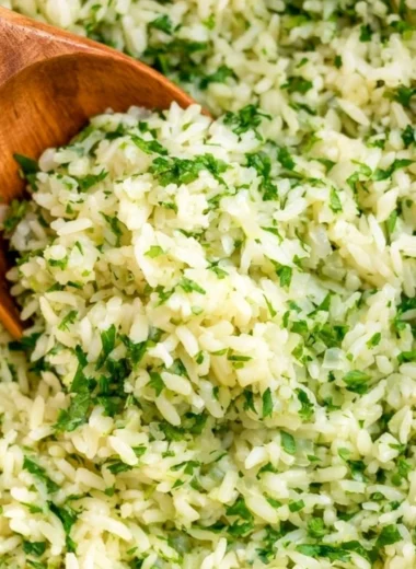 Bowl of flavorful cilantro lime rice garnished with fresh cilantro