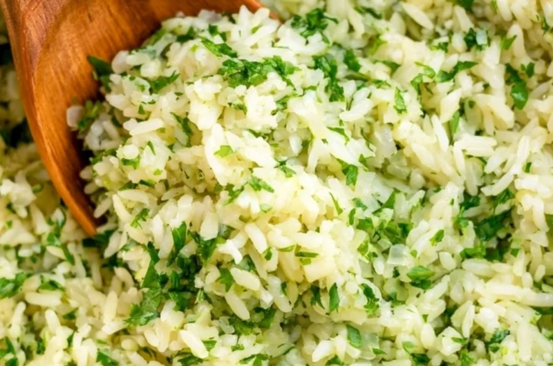 Bowl of flavorful cilantro lime rice garnished with fresh cilantro