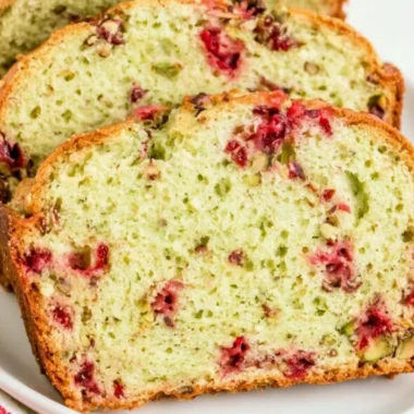 Freshly baked Cranberry Pistachio Bread with vibrant red cranberries and green pistachios