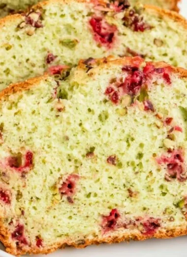 Freshly baked Cranberry Pistachio Bread with vibrant red cranberries and green pistachios
