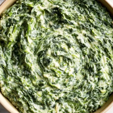 Delicious creamed spinach in a bowl, ready to serve as a side dish