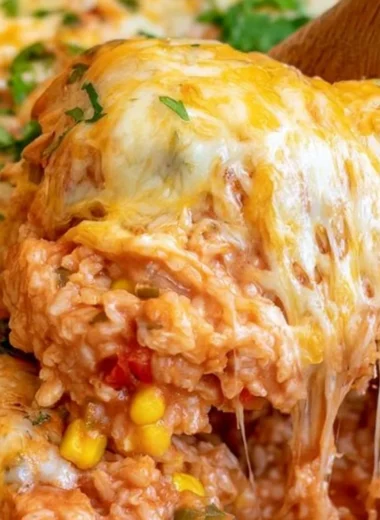 Delicious one pot cheesy enchilada rice dish ready to serve