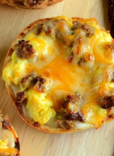 Delicious English Muffin Breakfast Pizza topped with cheese and eggs