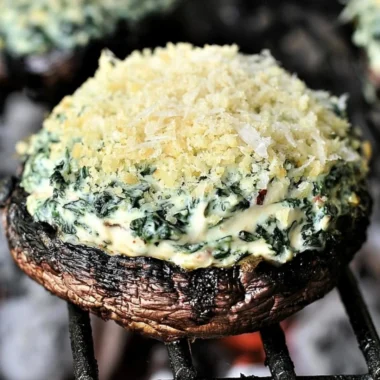 Grilled spinach dip stuffed in portabella mushroom caps, an irresistible appetizer.