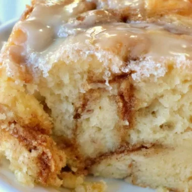 Delicious homemade cinnamon roll cake with cinnamon swirls on top