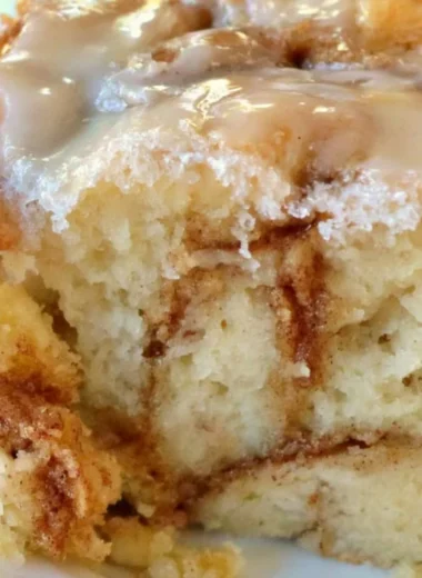 Delicious homemade cinnamon roll cake with cinnamon swirls on top