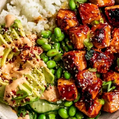 Honey Sriracha Salmon Bowl with fresh vegetables and rice
