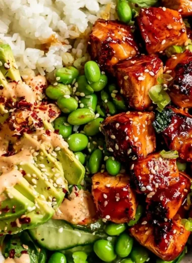 Honey Sriracha Salmon Bowl with fresh vegetables and rice