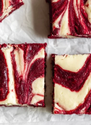 Red Velvet Cheesecake Brownies showcasing fudgy texture and creamy cheesecake swirl