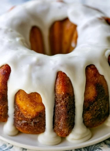 Homemade cinnamon roll bundt cake topped with creamy icing.