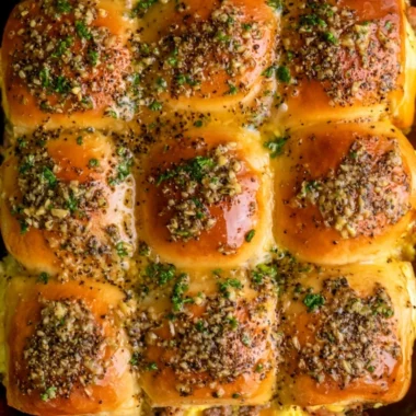 Delicious Cowboy Breakfast Sliders loaded with eggs, cheese, and sausage.