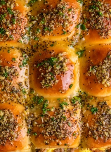 Delicious Cowboy Breakfast Sliders loaded with eggs, cheese, and sausage.
