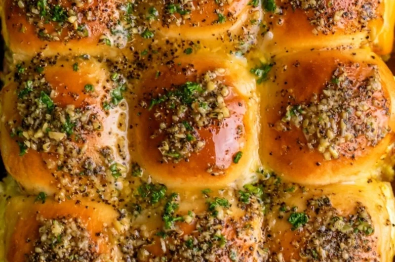Delicious Cowboy Breakfast Sliders loaded with eggs, cheese, and sausage.