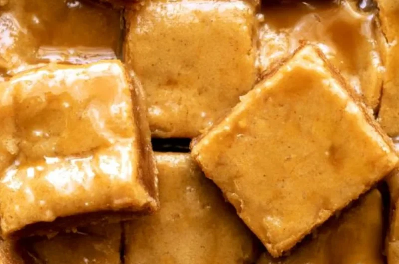 Delicious maple blondies topped with a rich maple glaze, ideal for dessert.