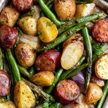 One Pan Sausage with green beans and potatoes on a serving plate.