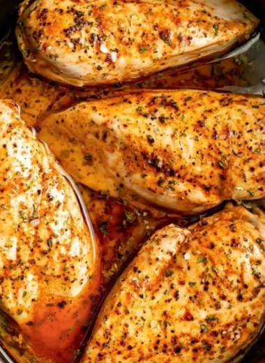 Tender slow cooker chicken breasts in a savory sauce