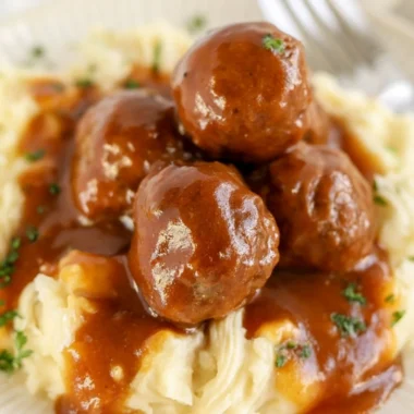 Delicious slow cooker Salisbury steak meatballs served with gravy