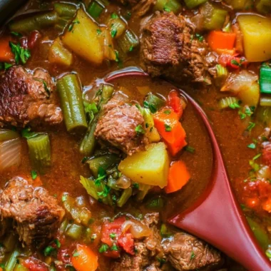 Bowl of delicious Vegetable Beef Soup with fresh vegetables and tender beef