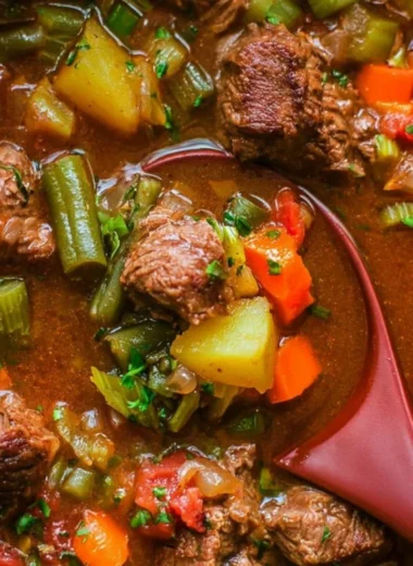 Bowl of delicious Vegetable Beef Soup with fresh vegetables and tender beef
