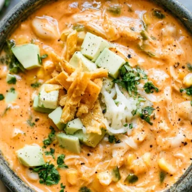 Bowl of award-winning white chicken chili garnished with cilantro and lime